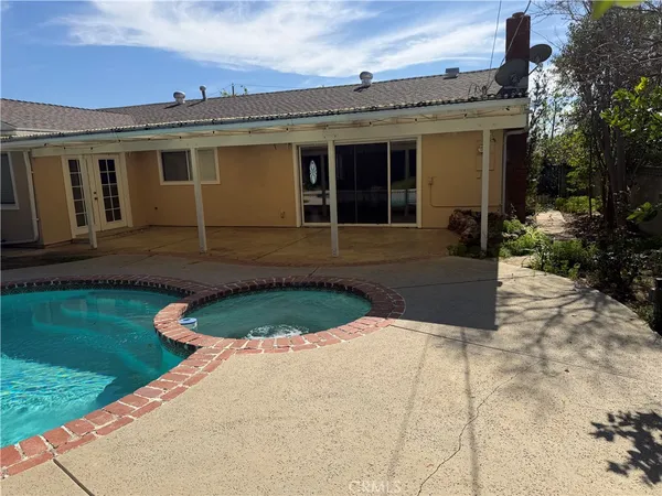 a kitchen with granite countertop a stove and a sink
