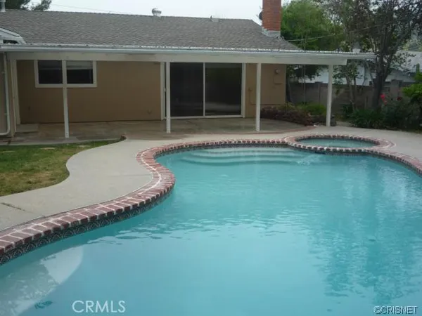 a view of backyard with cabin