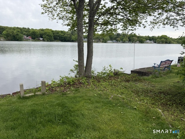 25 Lakeview Street Thompson, CT 06277 - Photo 1 of 7 a backyard of a house with lots of green space and lake view