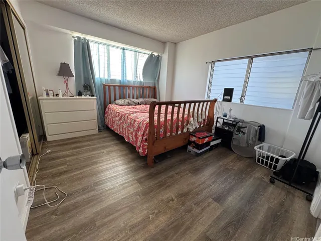 a bed room with a bed and a window