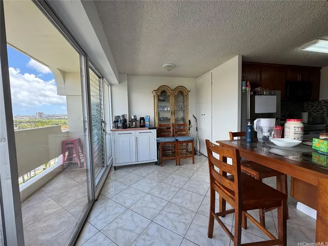 a kitchen with a table and chairs in it