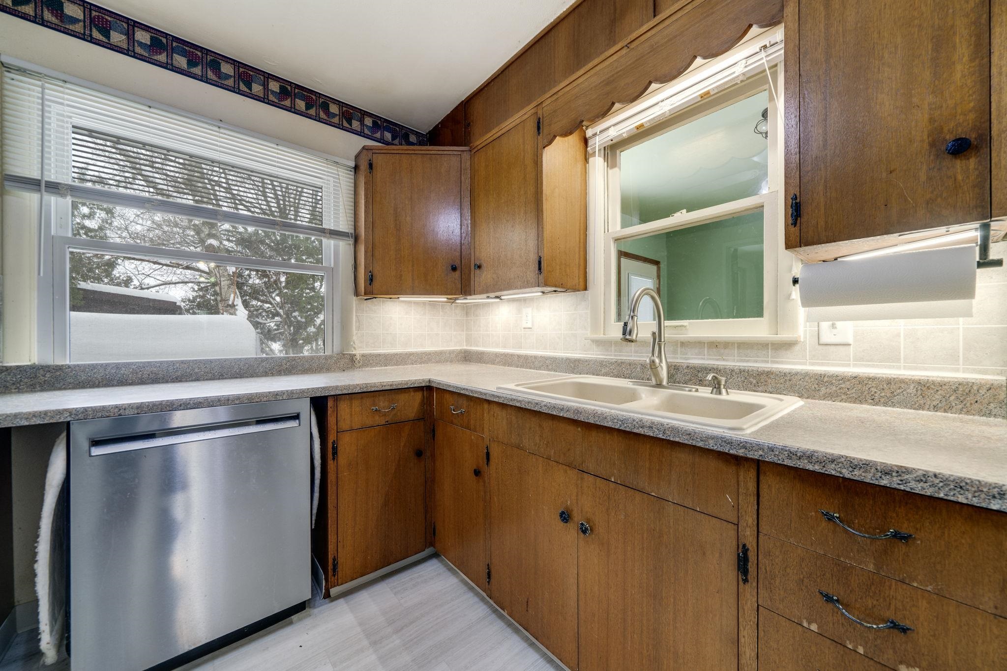 301 Barbara Street Mount Morris, IL 61054 - Photo 17 of 36 a kitchen with stainless steel appliances granite countertop a sink and a microwave