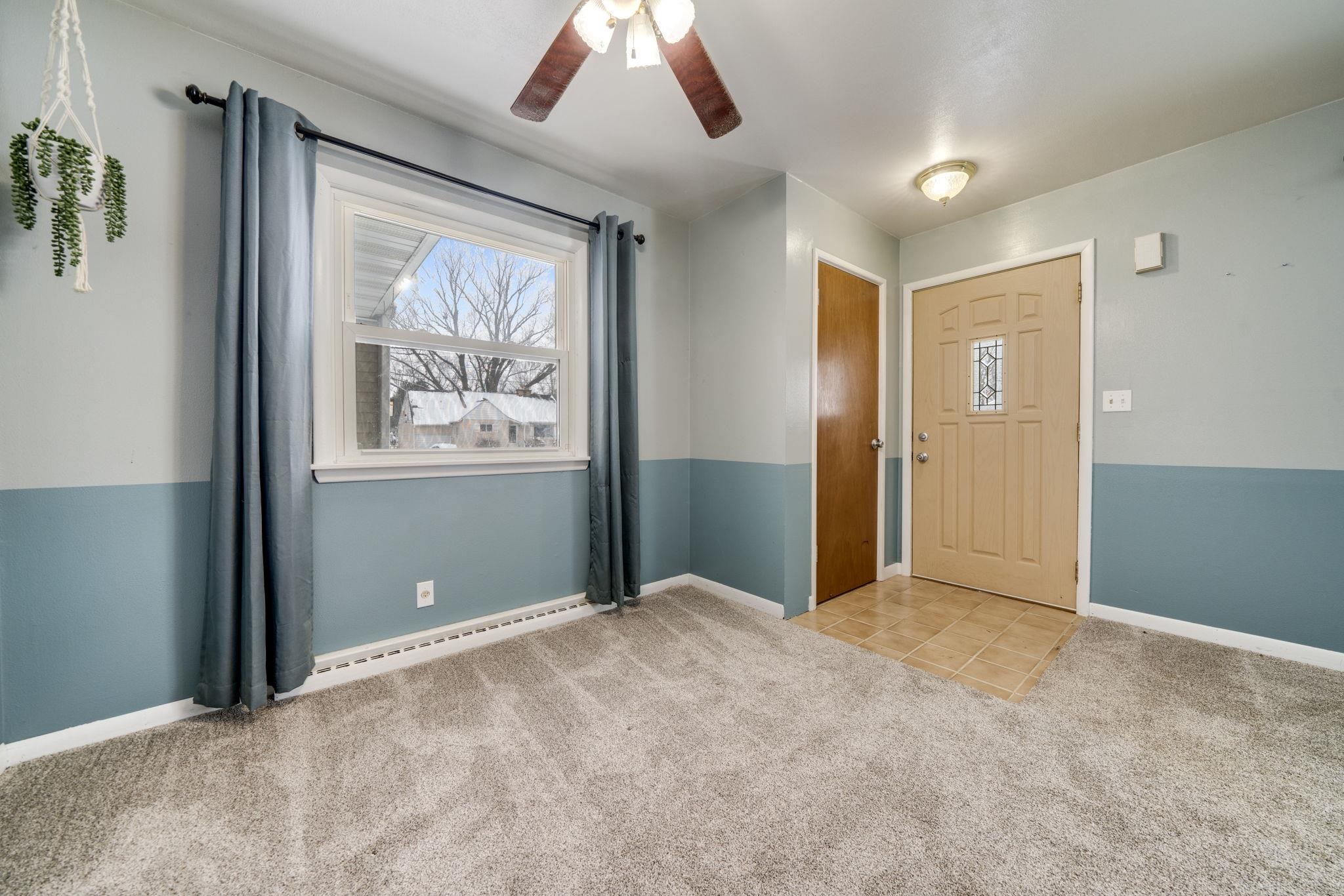 301 Barbara Street Mount Morris, IL 61054 - Photo 8 of 36 a view of an empty room with window and cabinet