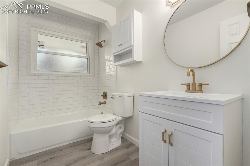 1216 Osgood Road Colorado Springs, CO 80915 - Photo 20 of 36 a bathroom with a sink a toilet and bathtub