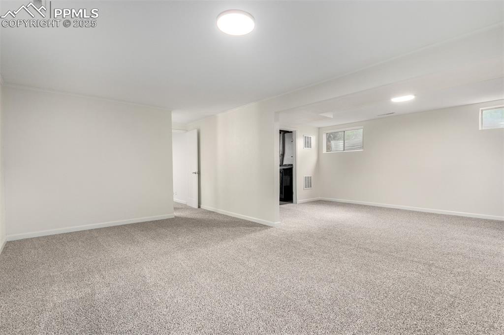 1216 Osgood Road Colorado Springs, CO 80915 - Photo 21 of 36 a view of an empty room with a kitchen