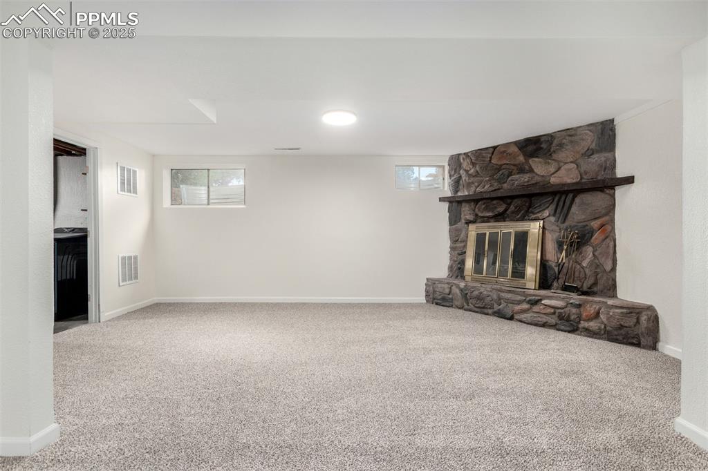 1216 Osgood Road Colorado Springs, CO 80915 - Photo 22 of 36 an empty room with windows