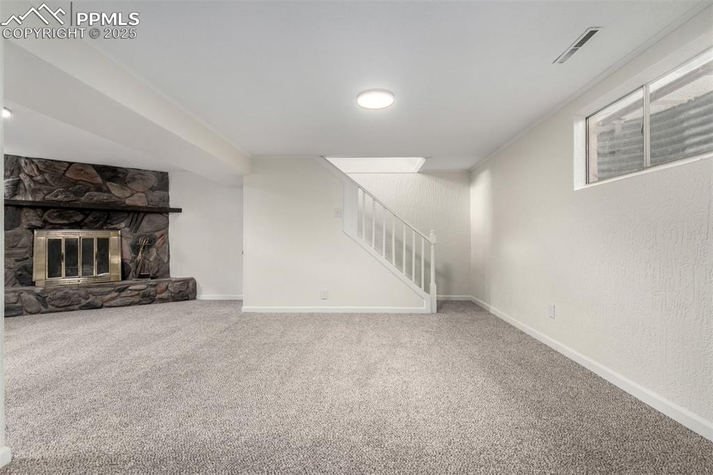 1216 Osgood Road Colorado Springs, CO 80915 - Photo 24 of 36 a view of an empty room with stairs