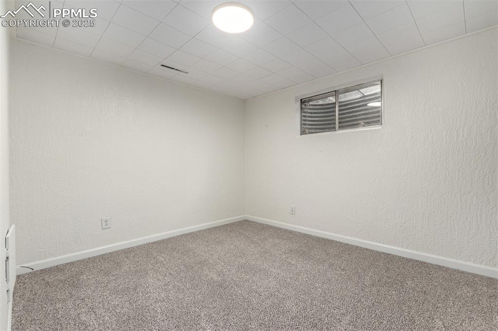 1216 Osgood Road Colorado Springs, CO 80915 - Photo 25 of 36 an empty room with a empty space