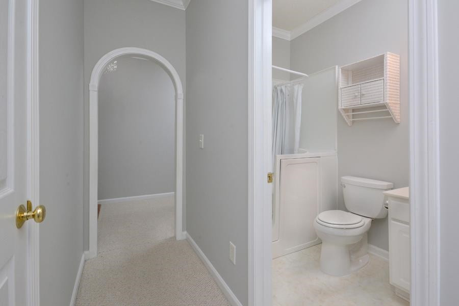 710 Latta Circle Durham, NC 27712 - Photo 17 of 42 a bathroom with a toilet and a sink