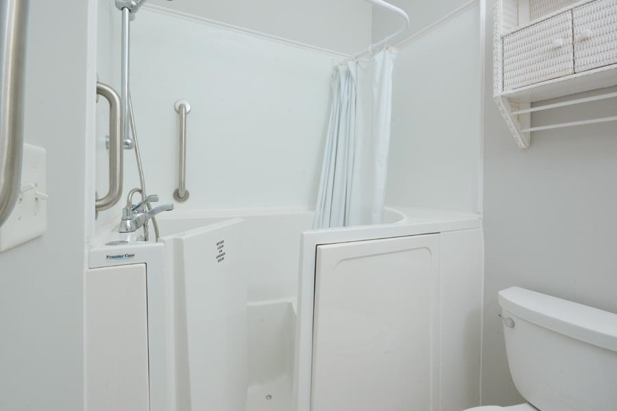 710 Latta Circle Durham, NC 27712 - Photo 19 of 42 a bathroom with a shower a toilet and sink