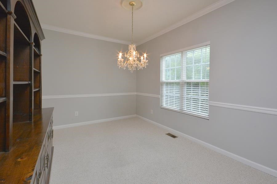 710 Latta Circle Durham, NC 27712 - Photo 21 of 42 a view of an empty room with a window