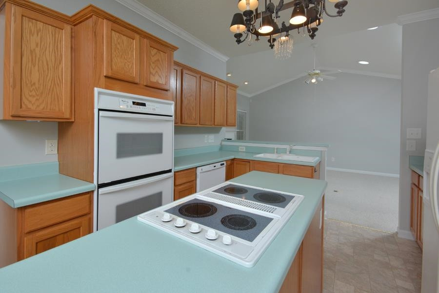 710 Latta Circle Durham, NC 27712 - Photo 24 of 42 a kitchen with a stove microwave and sink