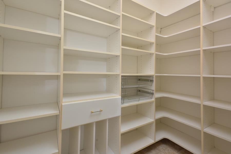 710 Latta Circle Durham, NC 27712 - Photo 35 of 42 a view of walk in closet with empty racks