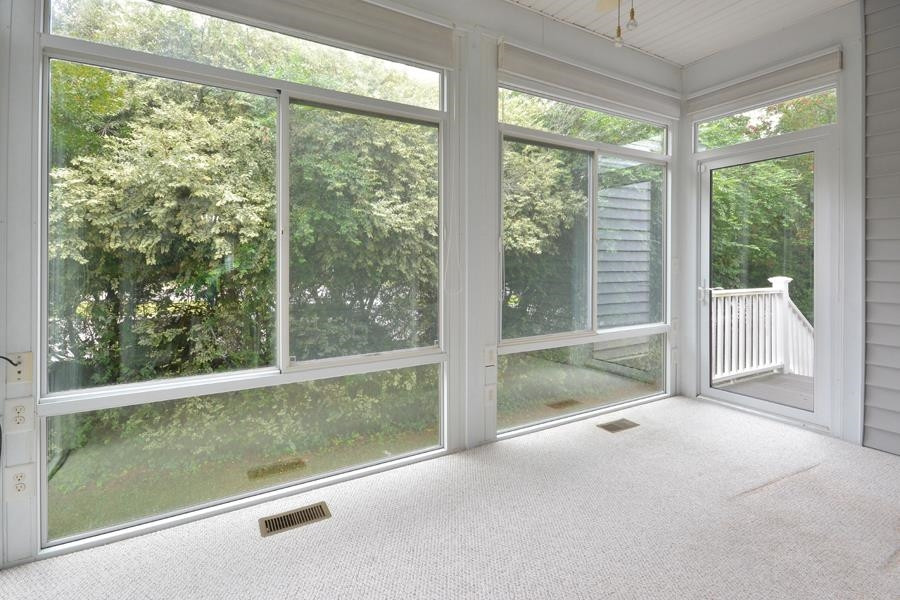 710 Latta Circle Durham, NC 27712 - Photo 7 of 42 a view of a room with wooden floor and windows