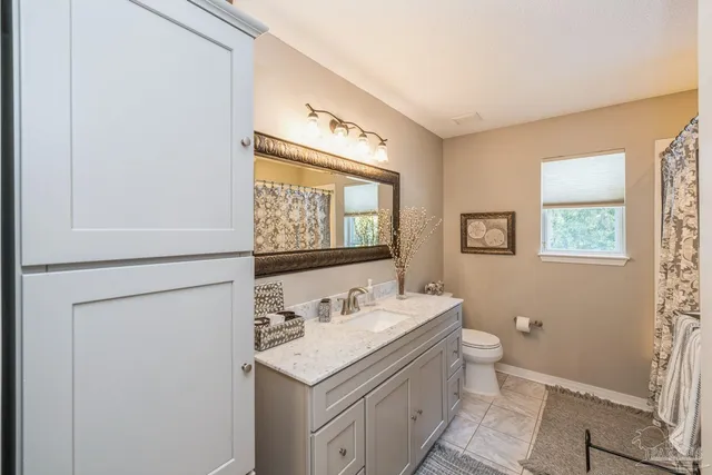 a spacious bedroom with a bed and a couch