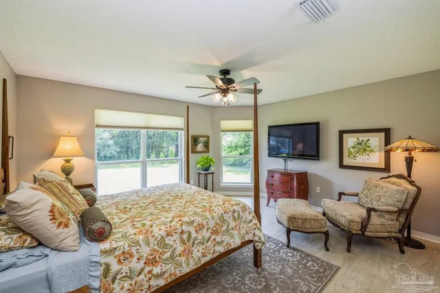 a bathroom with a sink mirror and vanity