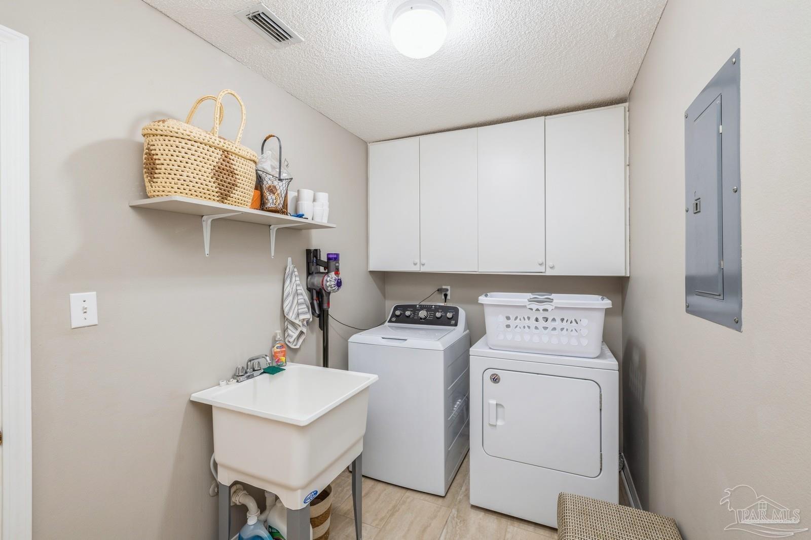 2808 P.G.A Boulevard Navarre, FL 32566 - Photo 37 of 54 a utility room with dryer and washer