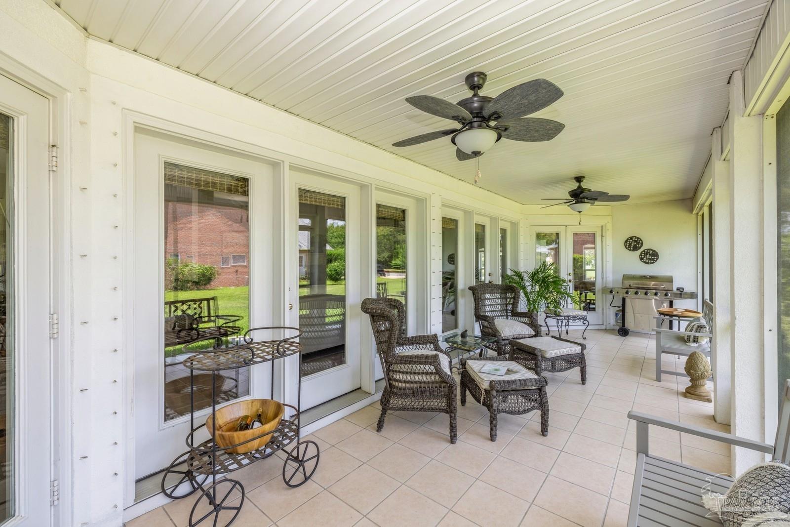 2808 P.G.A Boulevard Navarre, FL 32566 - Photo 38 of 54 a dining room with furniture and a large window