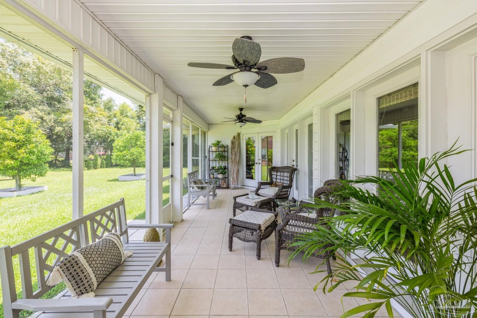 2808 P.G.A Boulevard Navarre, FL 32566 - Photo 39 of 54 a living room with furniture and a large window