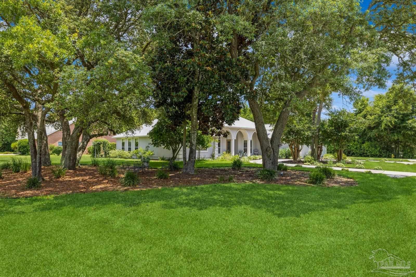 2808 P.G.A Boulevard Navarre, FL 32566 - Photo 41 of 54 a view of a park with large trees