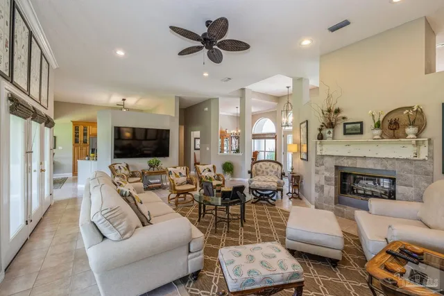a living room with furniture fireplace and a flat screen tv
