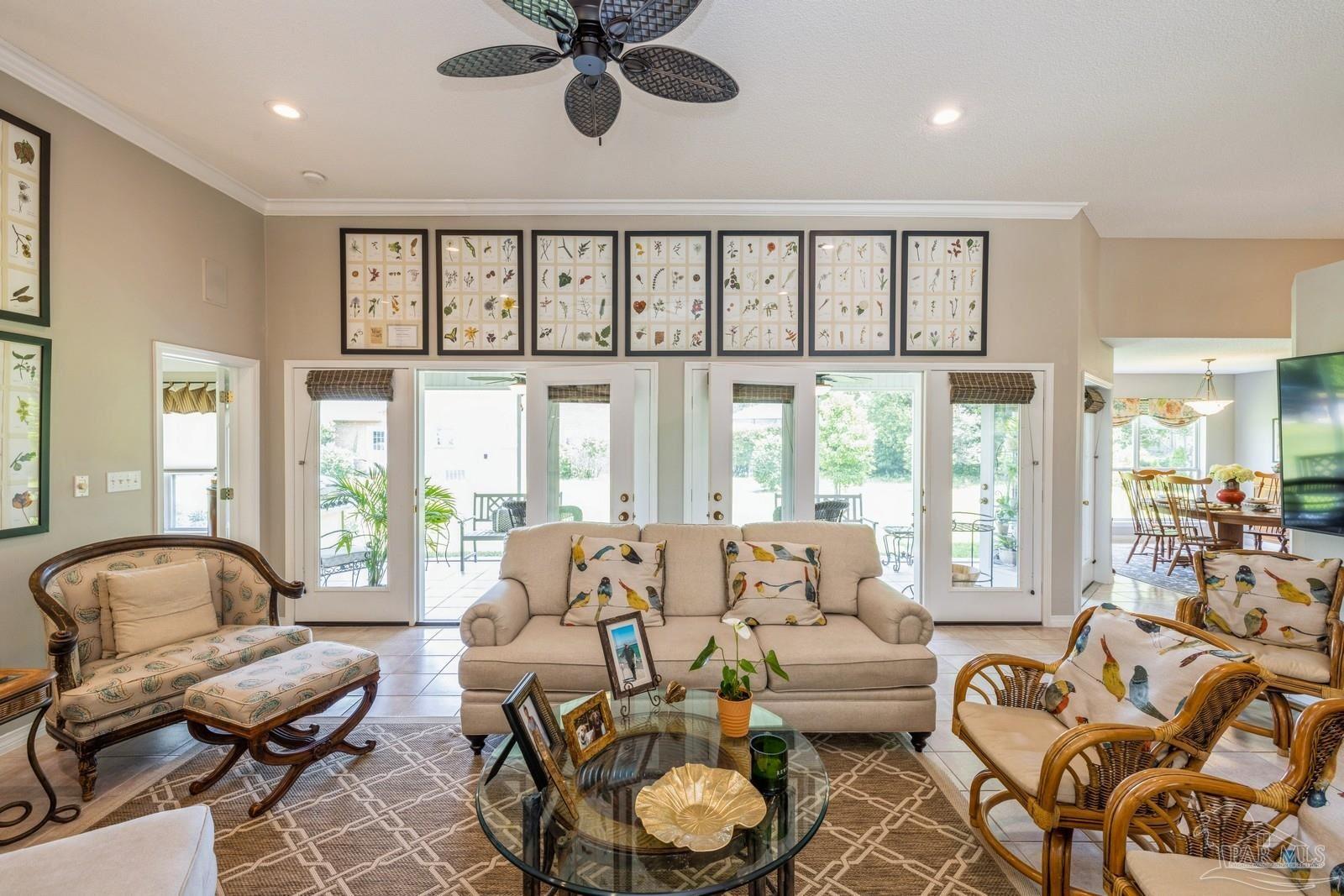 2808 P.G.A Boulevard Navarre, FL 32566 - Photo 7 of 54 a living room with furniture and a large window