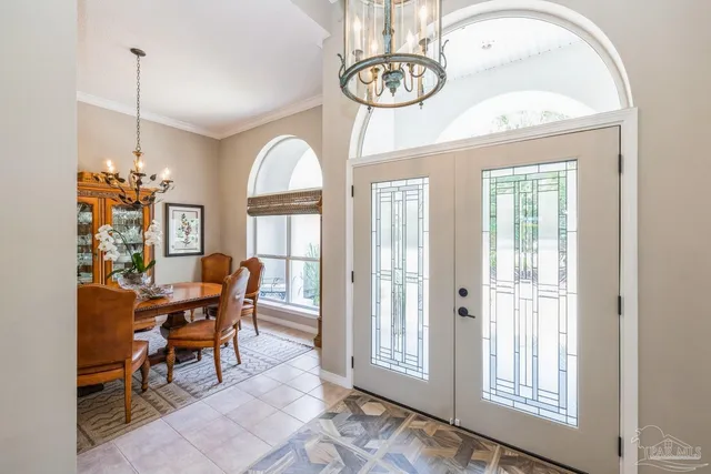 a view of a livingroom with furniture and a chandelier