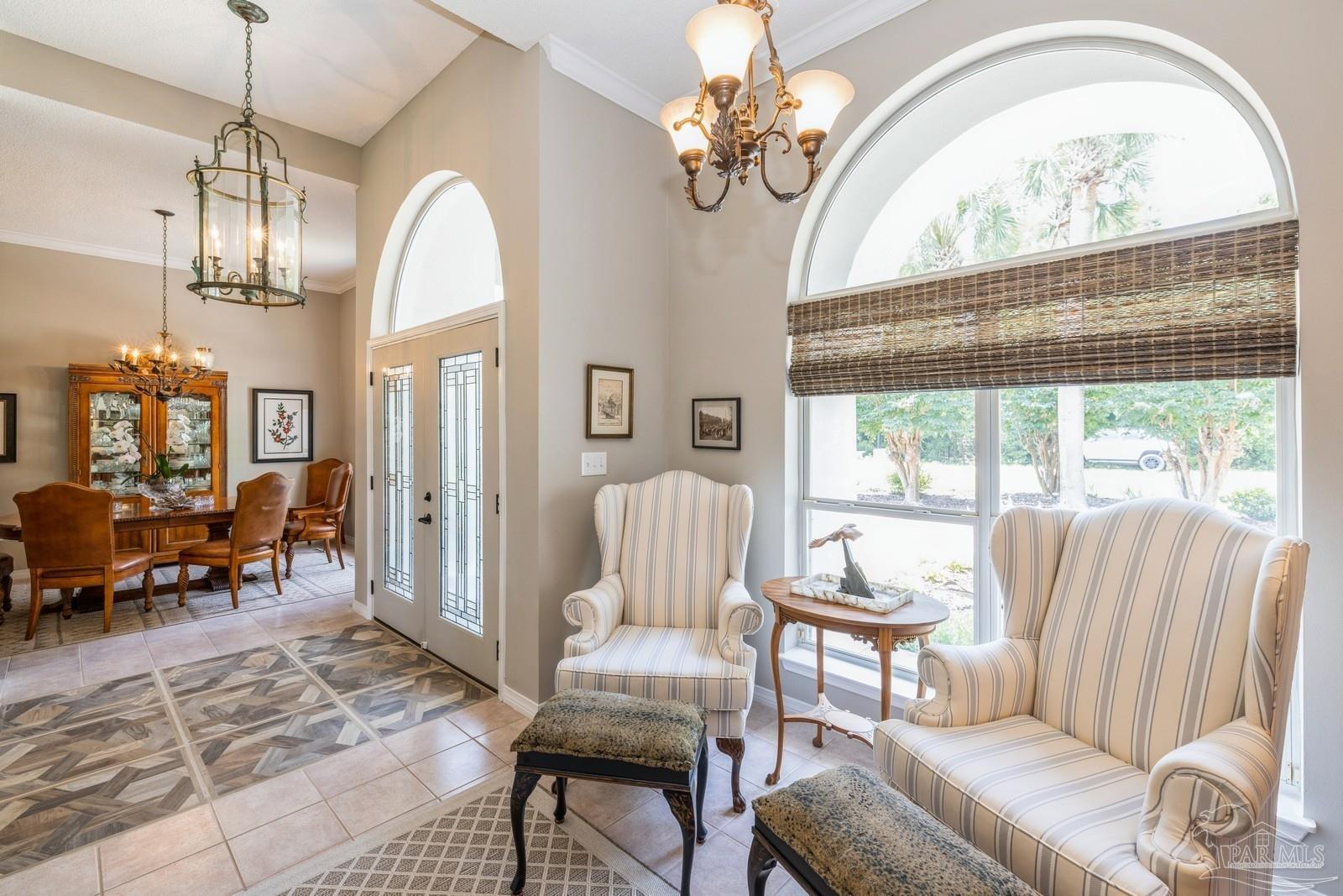 2808 P.G.A Boulevard Navarre, FL 32566 - Photo 10 of 54 a view of a livingroom with furniture and a chandelier