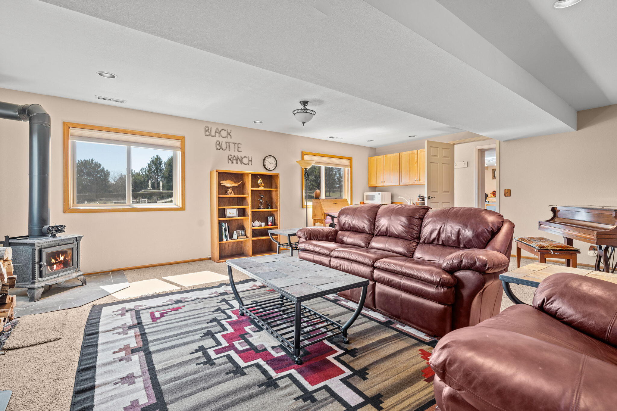 17375 Jordan Road Sisters, OR 97759 - Photo 42 of 63 Lower level bonus room with exterior entry and wood stove.