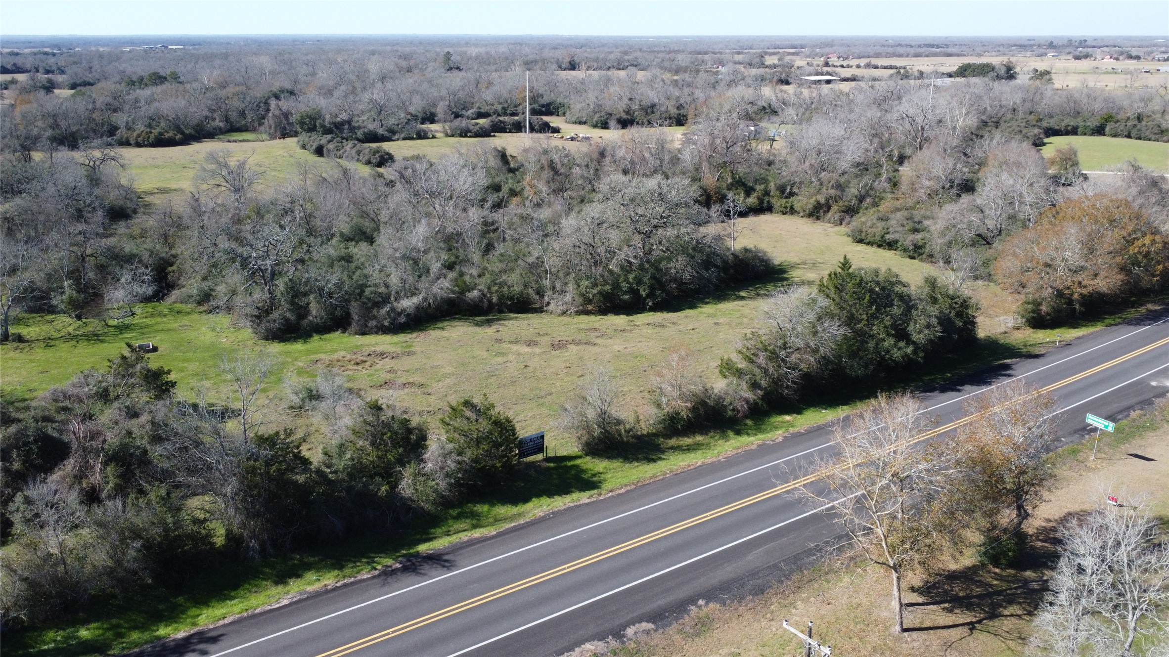 13403 Fm 359 Hempstead, TX 77445 - Photo 1 of 11 a view of a yard with wooden fence