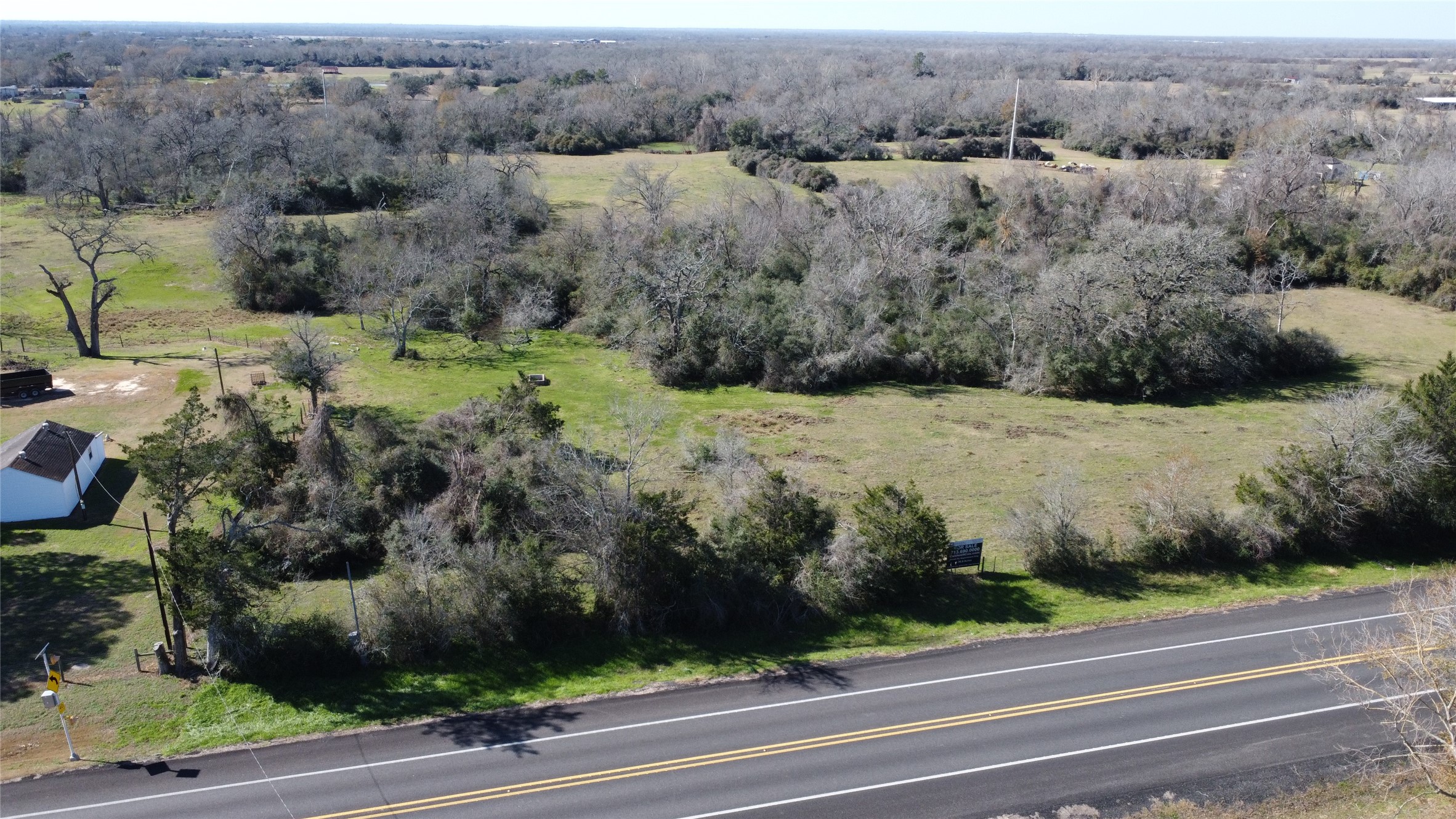 13403 Fm 359 Hempstead, TX 77445 - Photo 3 of 11 an aerial view of a houses with a yard