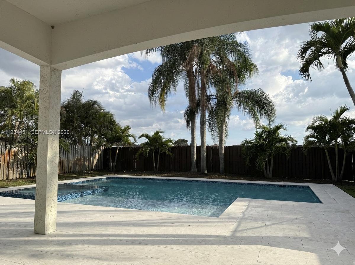 16364 Southwest 63rd Terrace Miami, FL 33193 - Photo 13 of 20 a view of swimming pool with palm trees