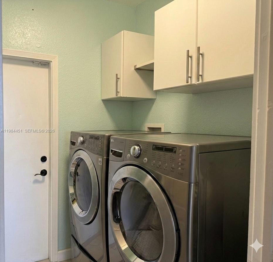 16364 Southwest 63rd Terrace Miami, FL 33193 - Photo 16 of 20 a utility room with dryer and washer