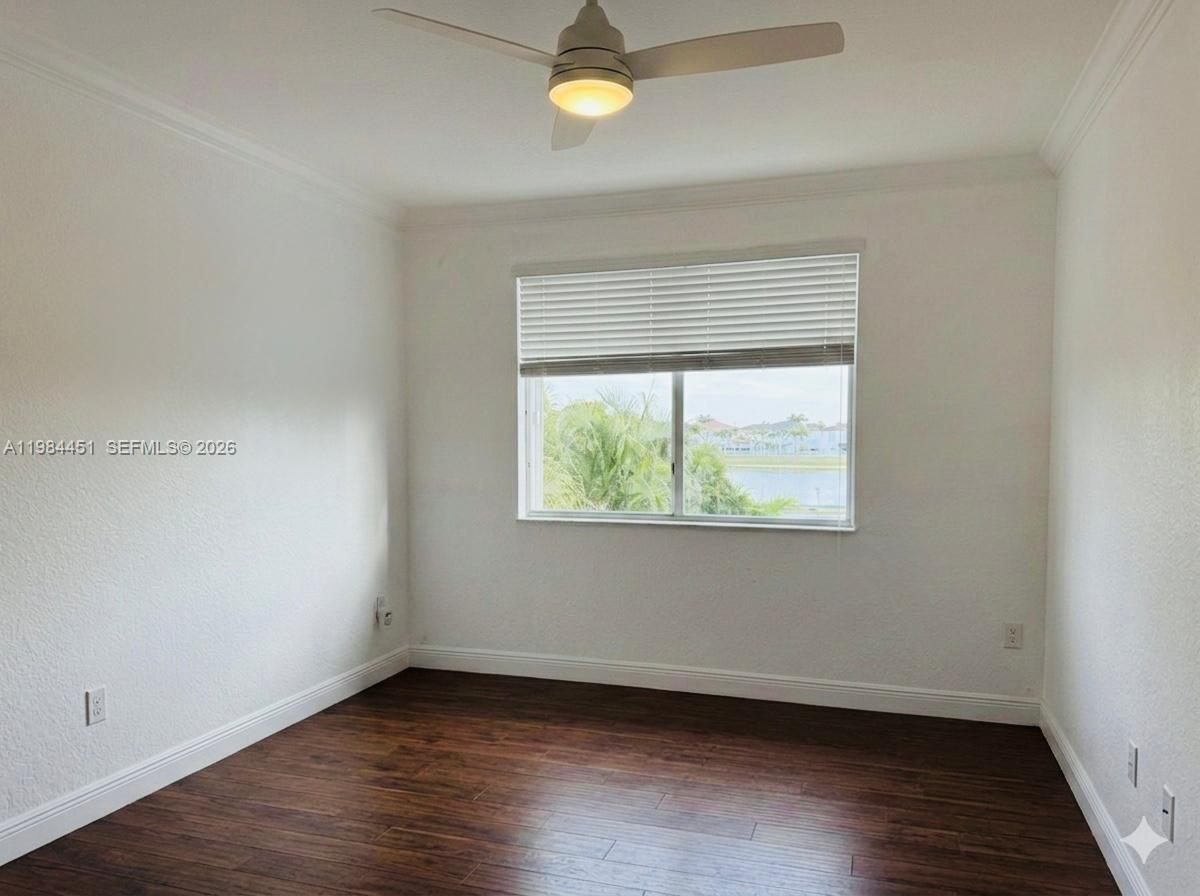 16364 Southwest 63rd Terrace Miami, FL 33193 - Photo 7 of 20 a view of an empty room with wooden floor and a window
