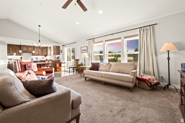 1145 North Christley Lane, Unit 48 Elk Ridge, UT 84651 - Photo 8 of 38 Spacious living area featuring vaulted ceilings, recessed lighting, and large windows with roller shades