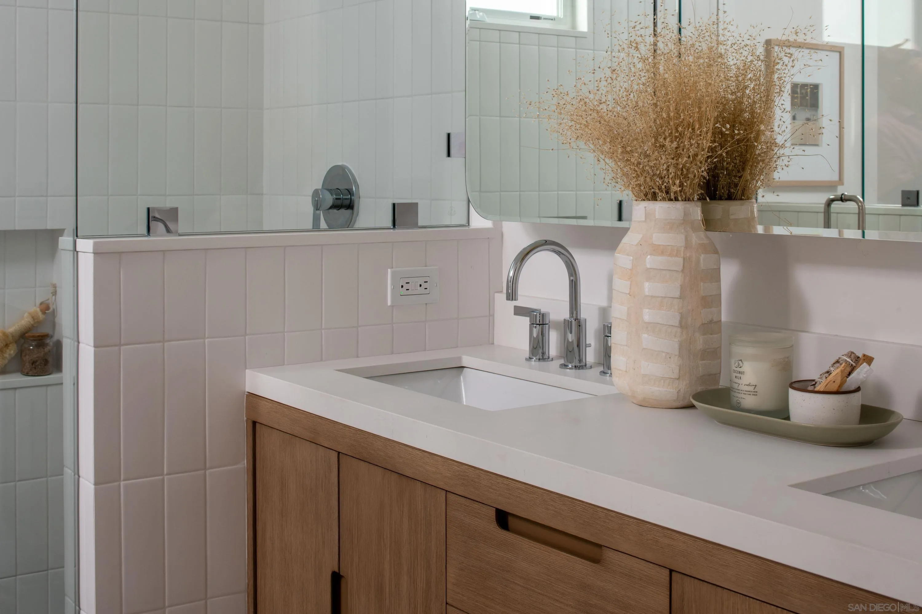 1025 Wilbur Avenue San Diego, CA 92109 - Photo 28 of 52 a bathroom with a sink and a mirror