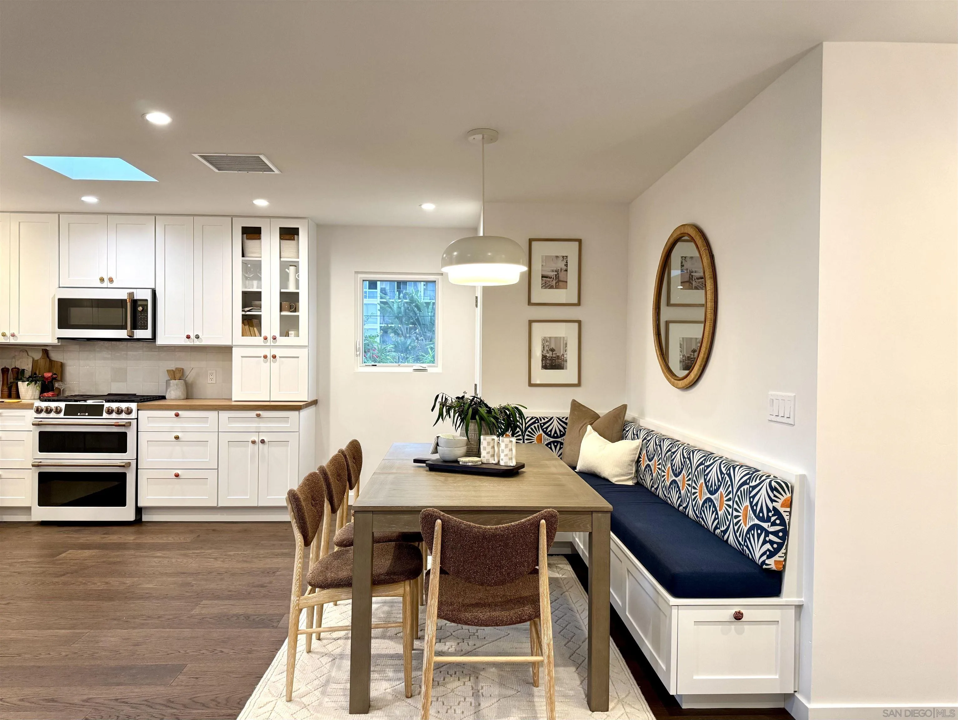 1025 Wilbur Avenue San Diego, CA 92109 - Photo 49 of 52 a kitchen with a refrigerator and a stove top oven