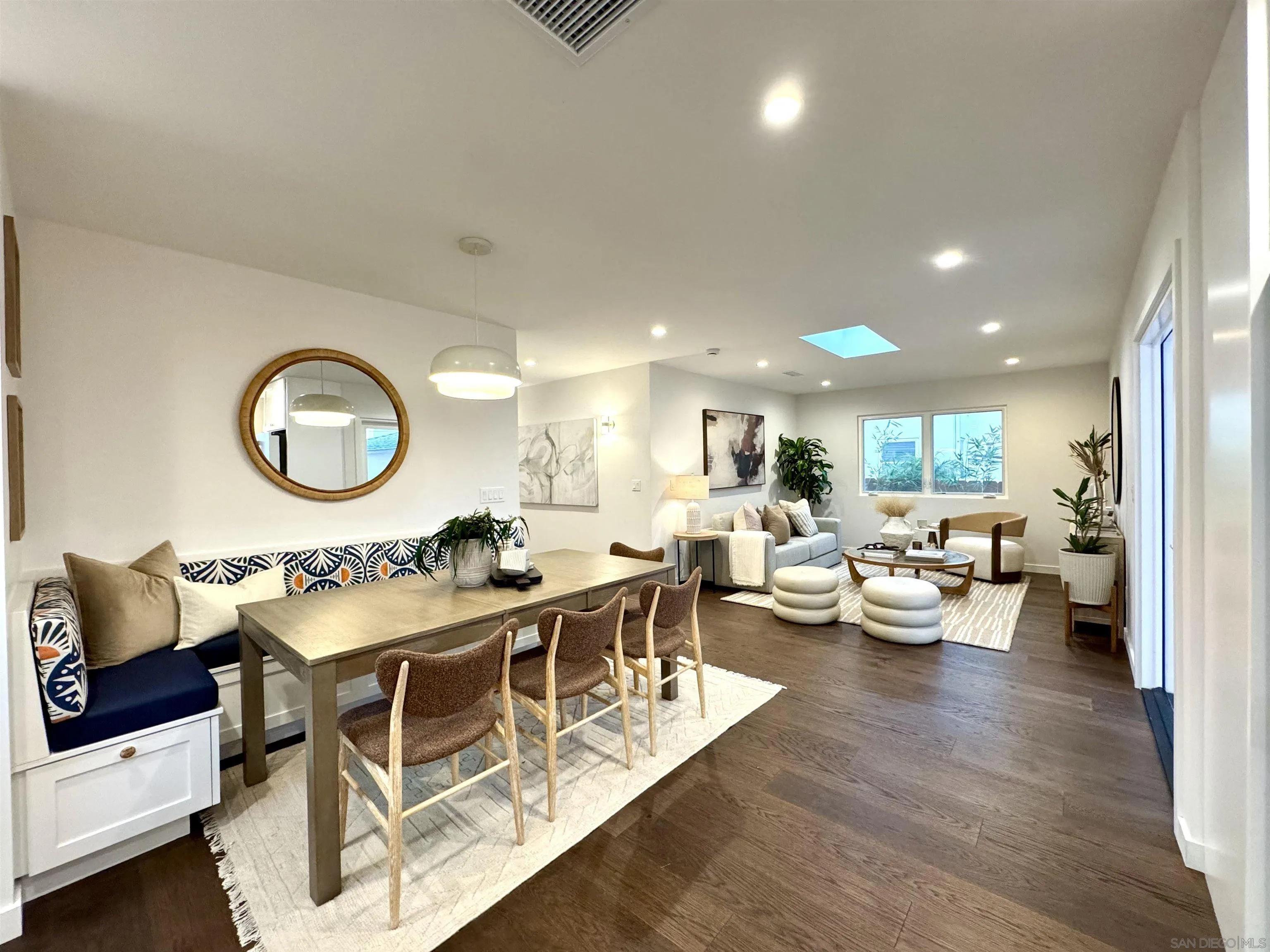 1025 Wilbur Avenue San Diego, CA 92109 - Photo 51 of 52 a view of a dining room with furniture and a wooden floor