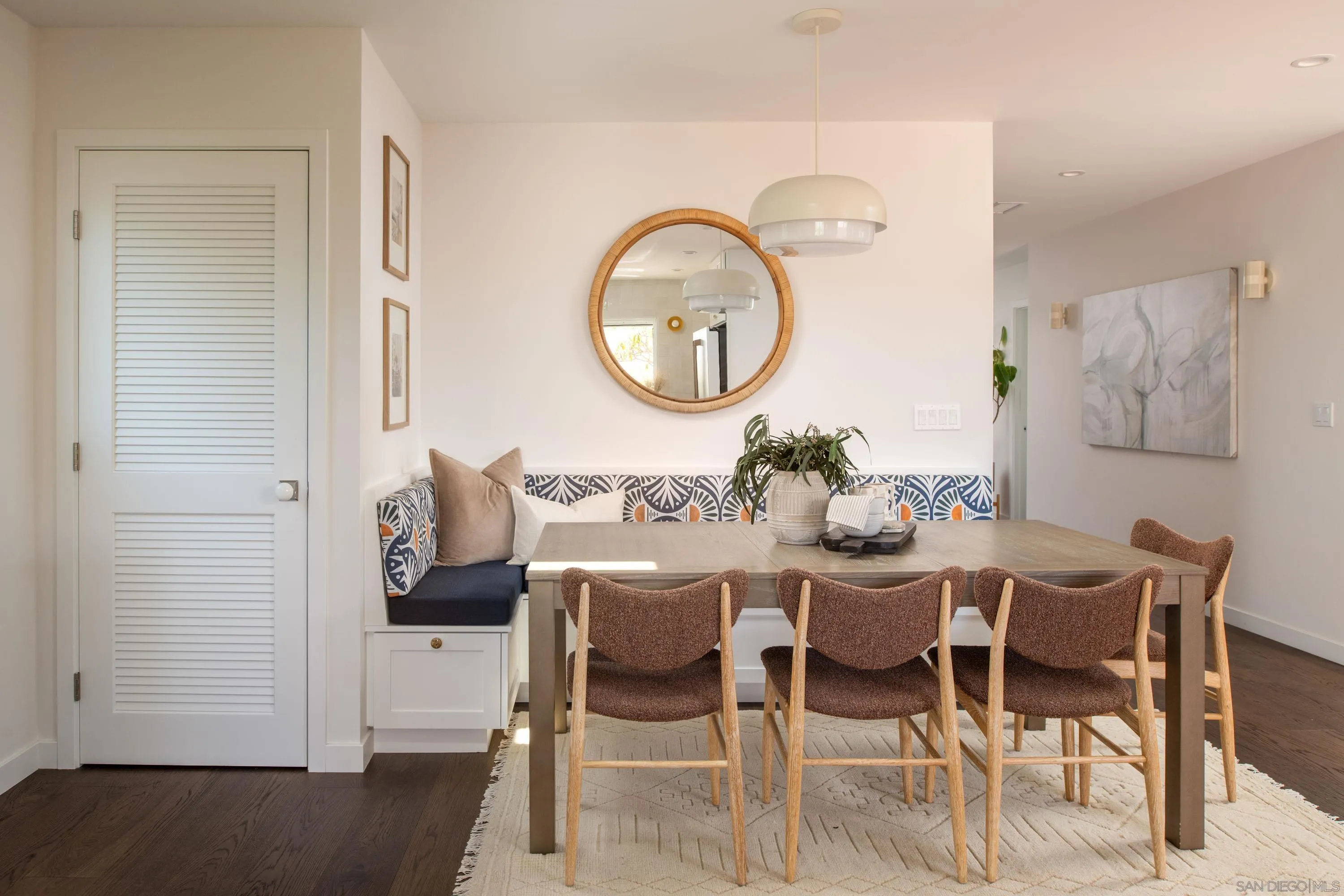 1025 Wilbur Avenue San Diego, CA 92109 - Photo 9 of 52 a dining room with furniture and a mirror