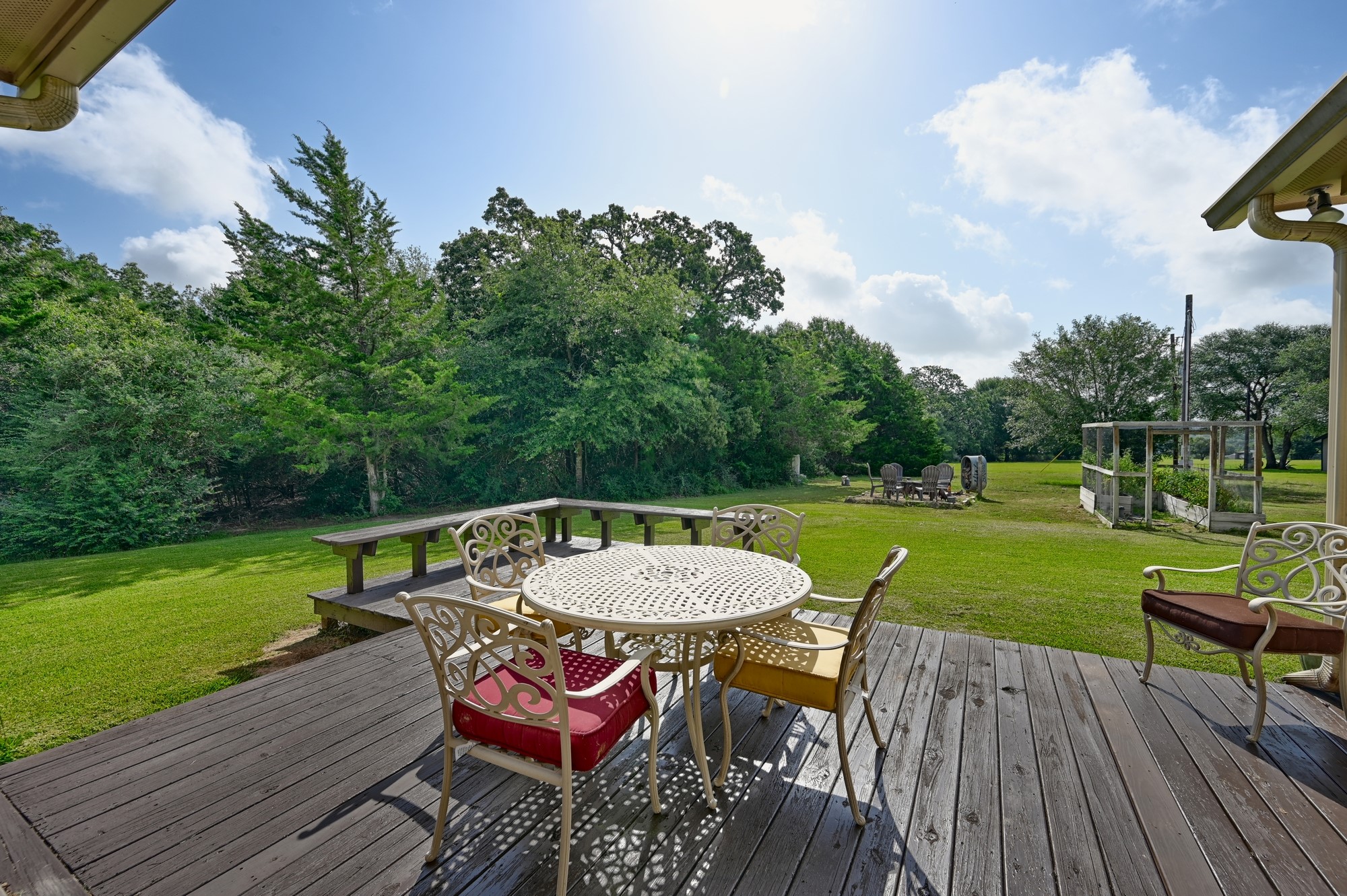 1205 Pecan Glen Road Brenham, TX 77833 - Photo 17 of 40 Step out back to the long porches and added deck for entertaining