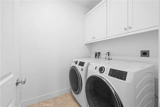 a view of a hallway with wooden floor and glass door