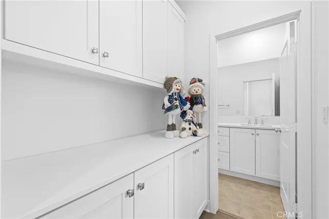 an empty room with windows and entrance