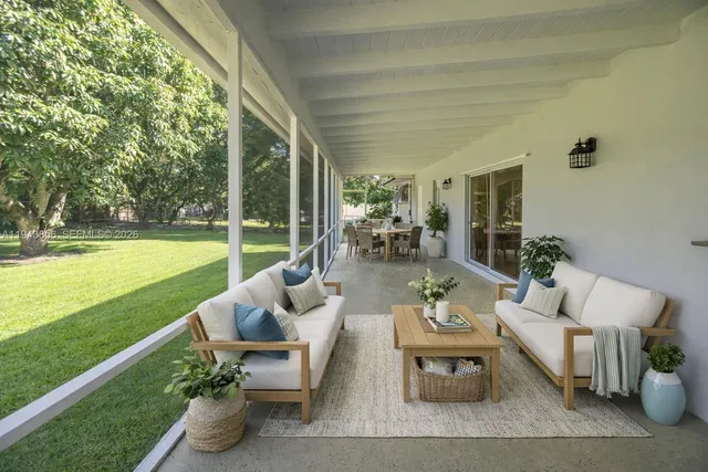 a outdoor living space with furniture and garden view