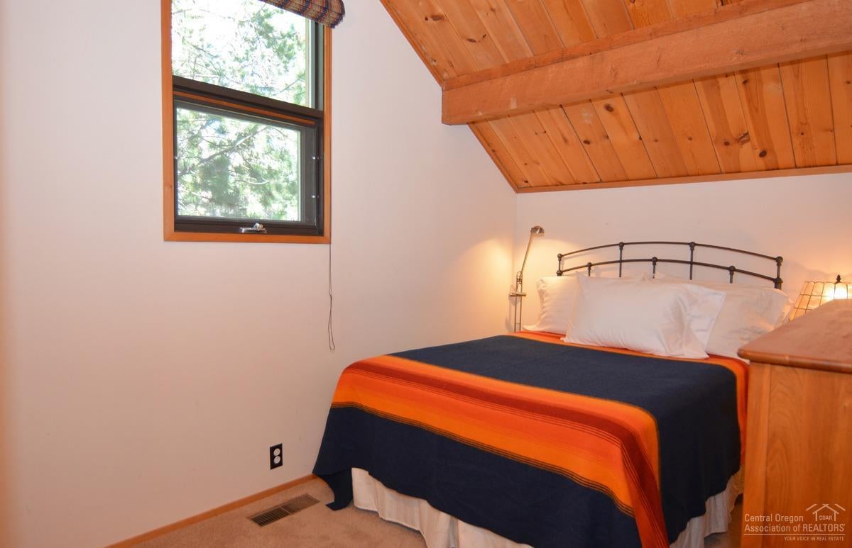 57515 Ranch Cabin Road, Unit B15 Sunriver, OR 97707 - Photo 16 of 21 Vaulted ceiling in bedroom one.