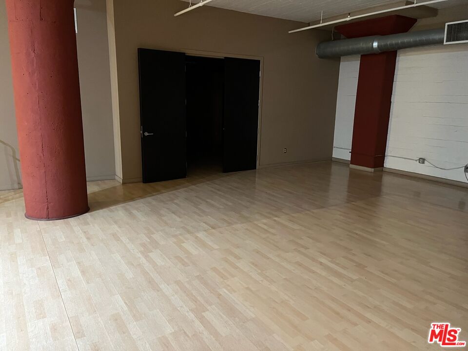 1855 Industrial Street, Unit 509 Los Angeles, CA 90021 - Photo 12 of 19 a view of empty room with wooden floor
