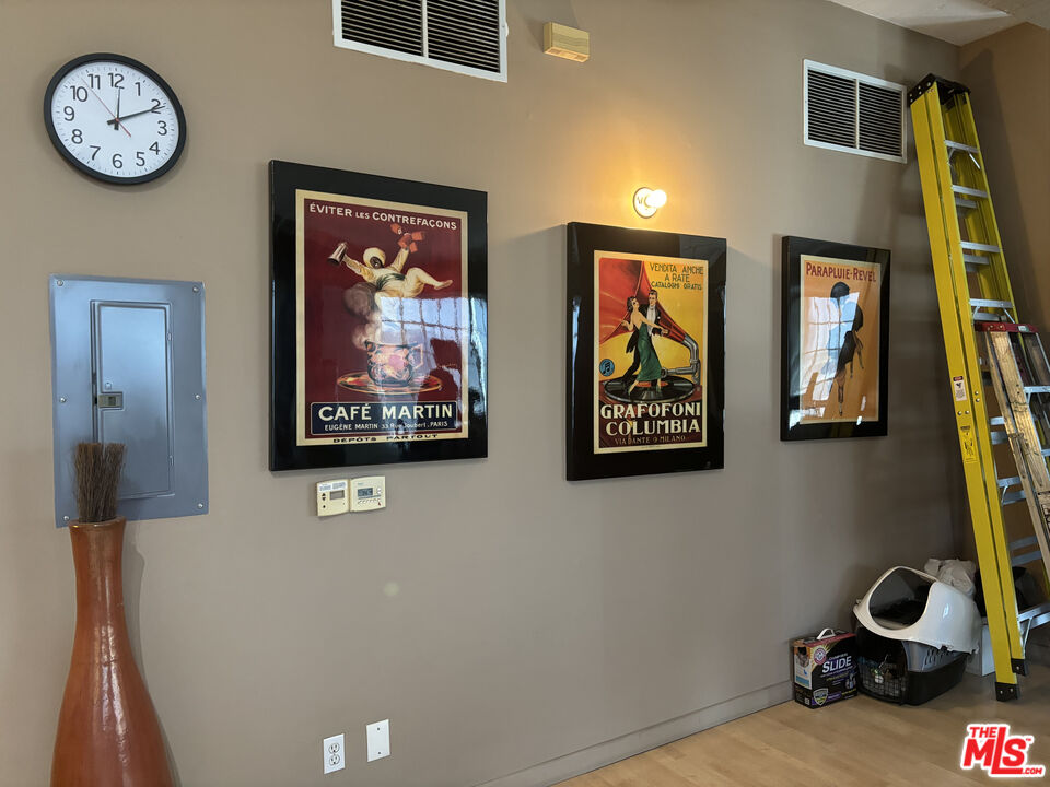 1855 Industrial Street, Unit 509 Los Angeles, CA 90021 - Photo 3 of 19 a view of a hallway with paintings on the wall