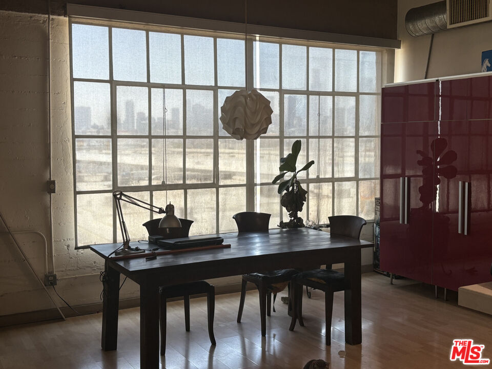 1855 Industrial Street, Unit 509 Los Angeles, CA 90021 - Photo 5 of 19 a view of a workspace with furniture and a window