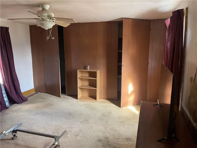 a wooden bench sitting in middle of a yard