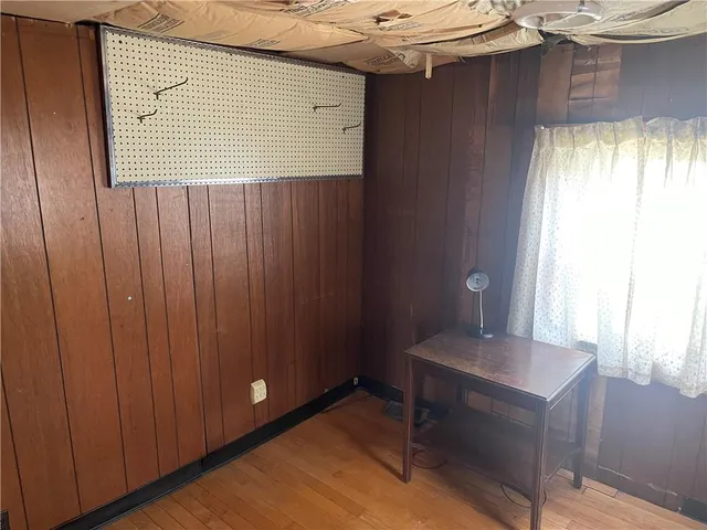 a view of a room that has a table and a chair