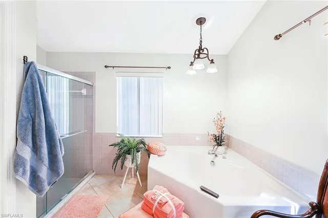 a bathroom with a bathtub and a sink